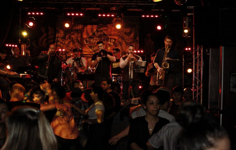 people playing instruments in a band